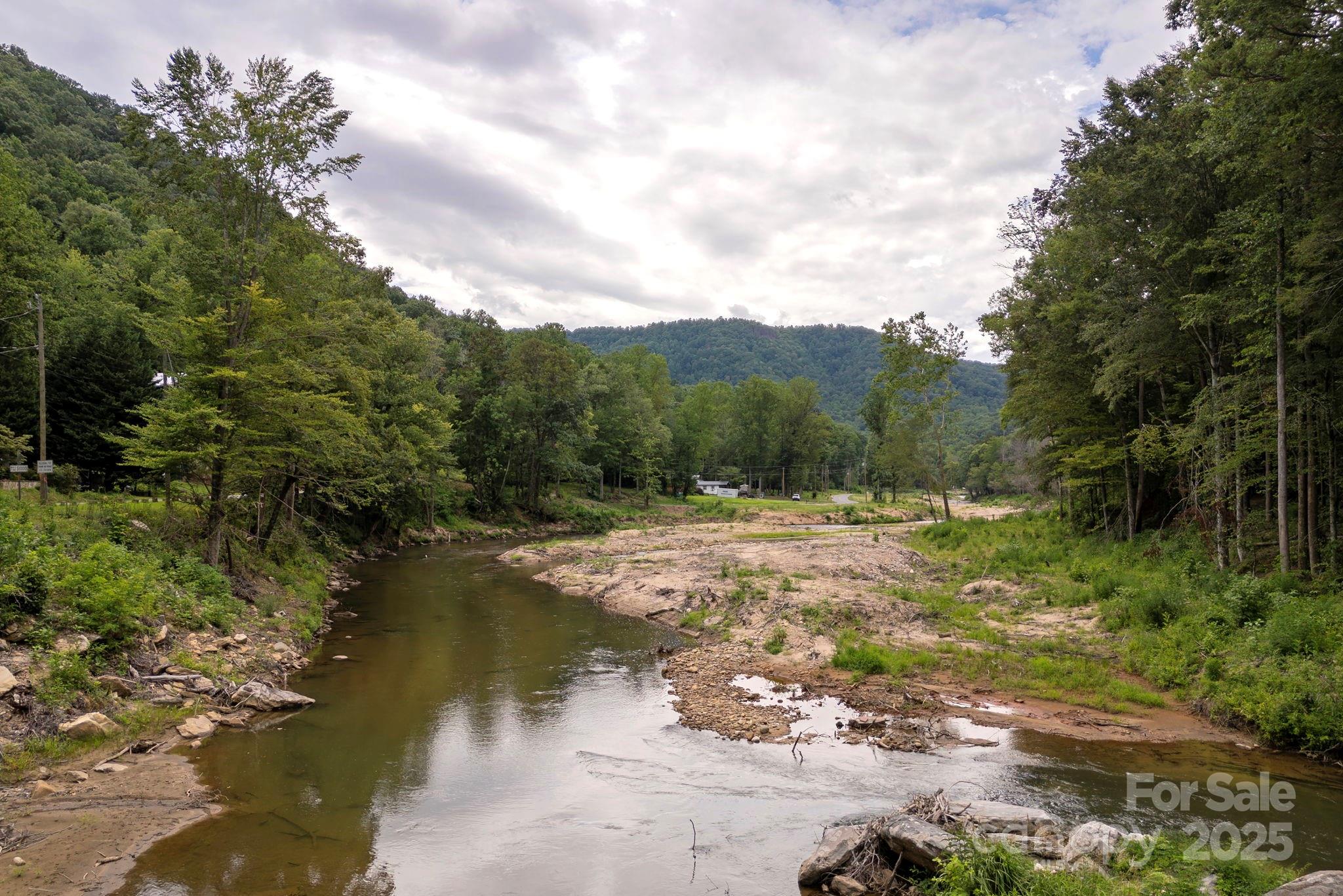 0 Green River Cove Road Saluda, NC 28773 - Photo 2 of 31 a view of a lake with a mountain