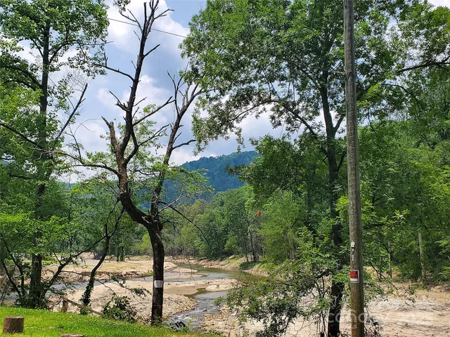 a view of a street with trees