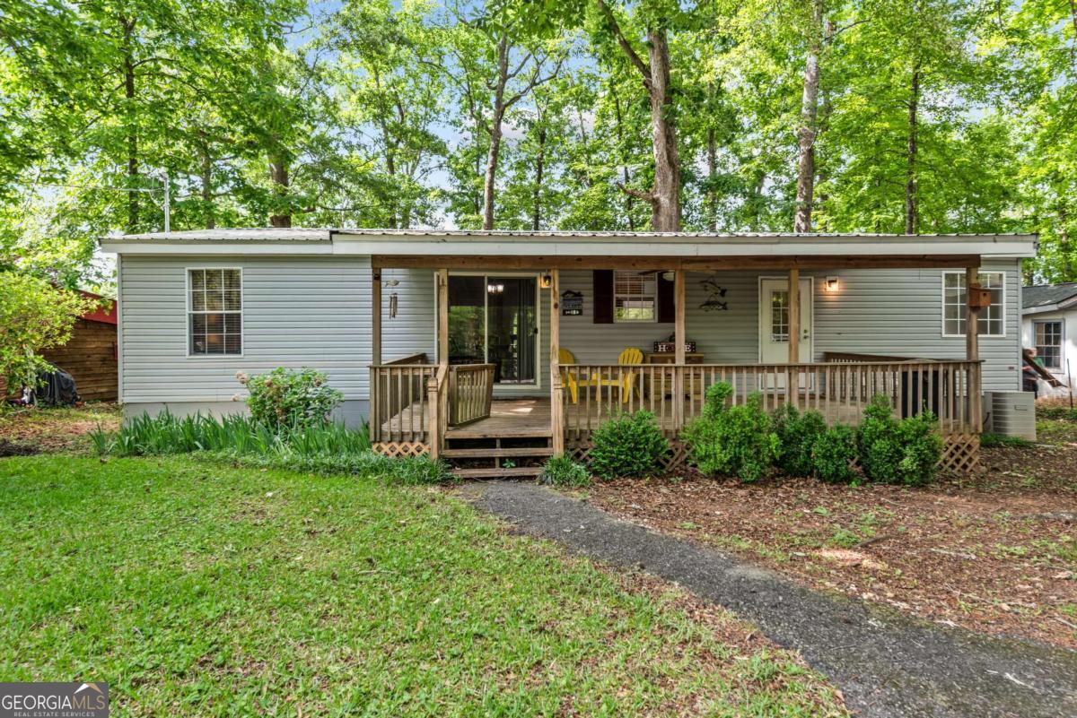 194 Phillips Road Eatonton, GA 31024 - Photo 37 of 57 front view of a house with a yard