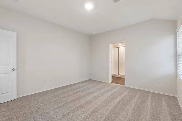 a view of an empty room and window