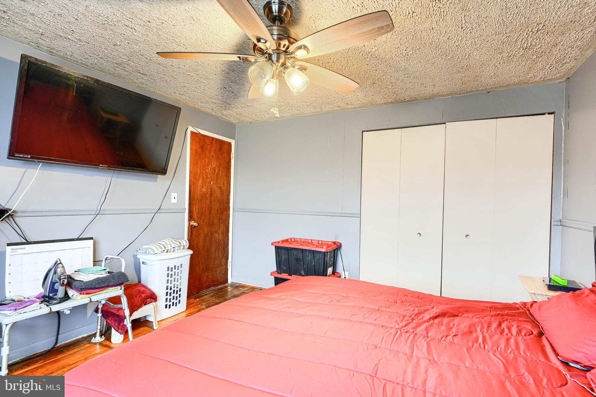 5552 Whitby Road Baltimore, MD 21206 - Photo 13 of 29 a bedroom with a bed and a chandelier