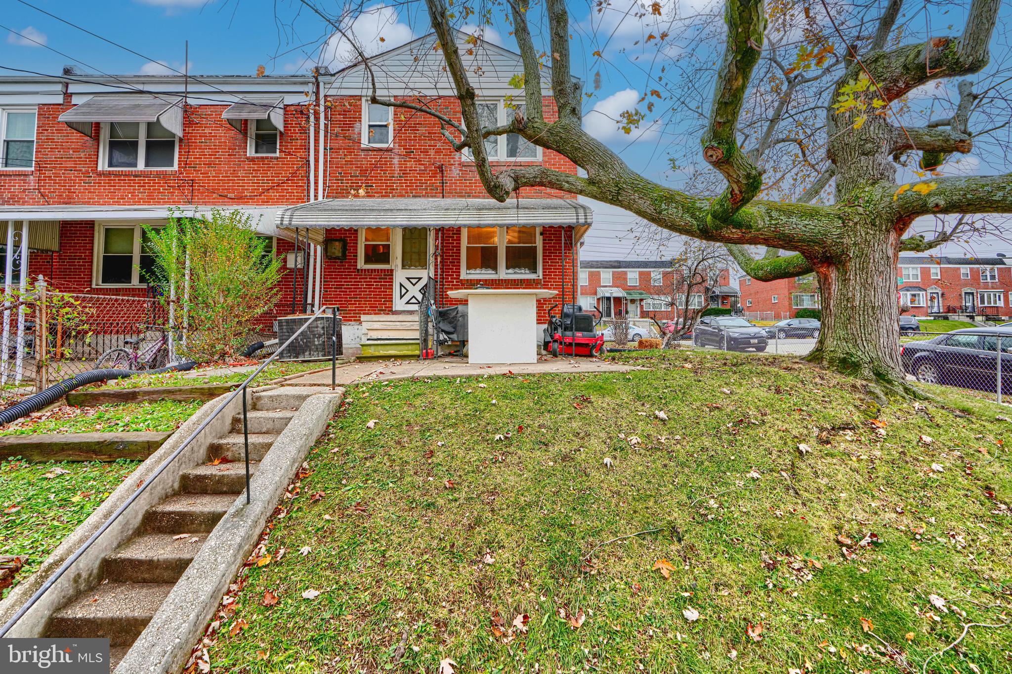 5552 Whitby Road Baltimore, MD 21206 - Photo 22 of 29 a front view of a building with a garden and plants