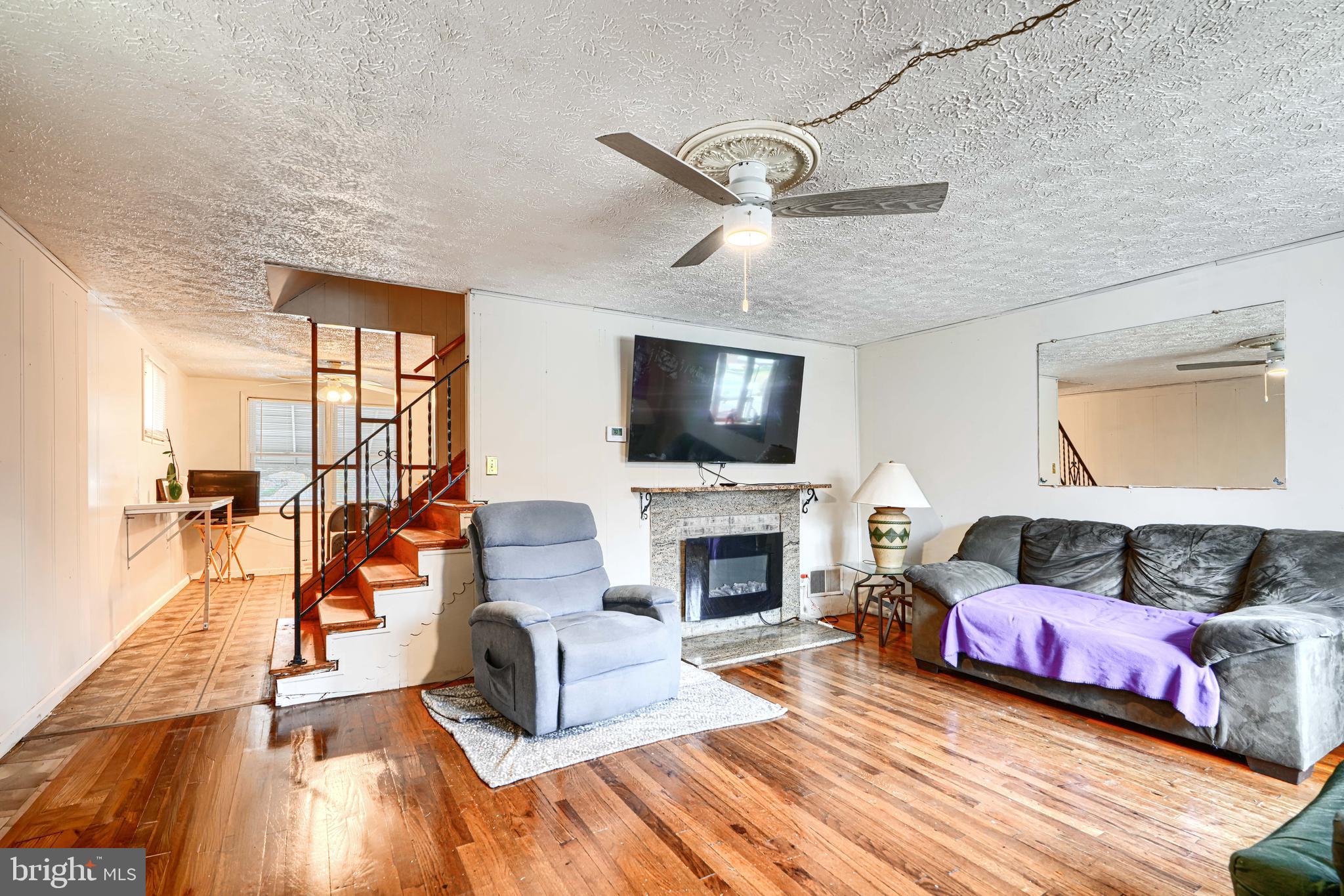 5552 Whitby Road Baltimore, MD 21206 - Photo 6 of 29 a living room with furniture and a fireplace