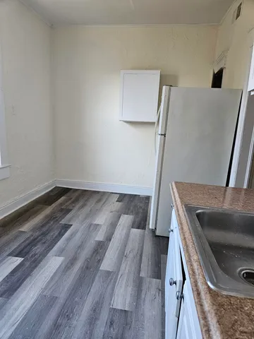 a bathroom with a sink a toilet and a bathtub