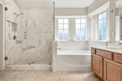 a bathroom with a bathtub and a sink