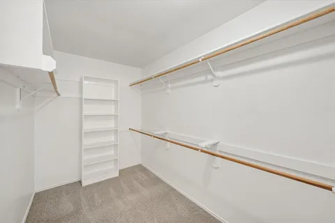 a view of an empty walk in closet