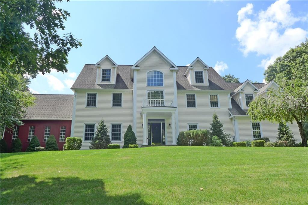 Welcome to this private, spacious 12 room Colonial majestically sited on a 3.32 acre knoll with the lush lawn and shrubbery.