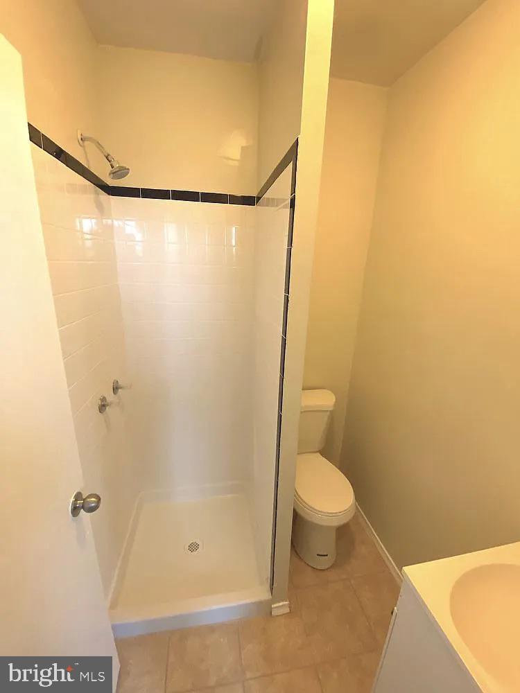 4726 Chestnut Street, Unit 2 Philadelphia, PA 19139 - Photo 3 of 3 a bathroom with a toilet and a shower
