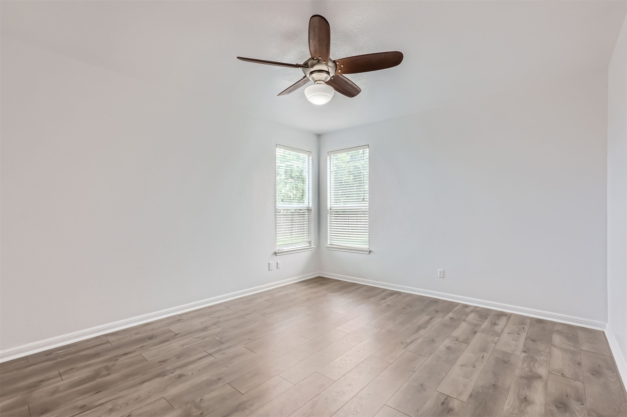 131 Lavaca Loop Hutto, TX 78634 - Photo 9 of 29 A quiet retreat with a classic ceiling fan and ample natural light.