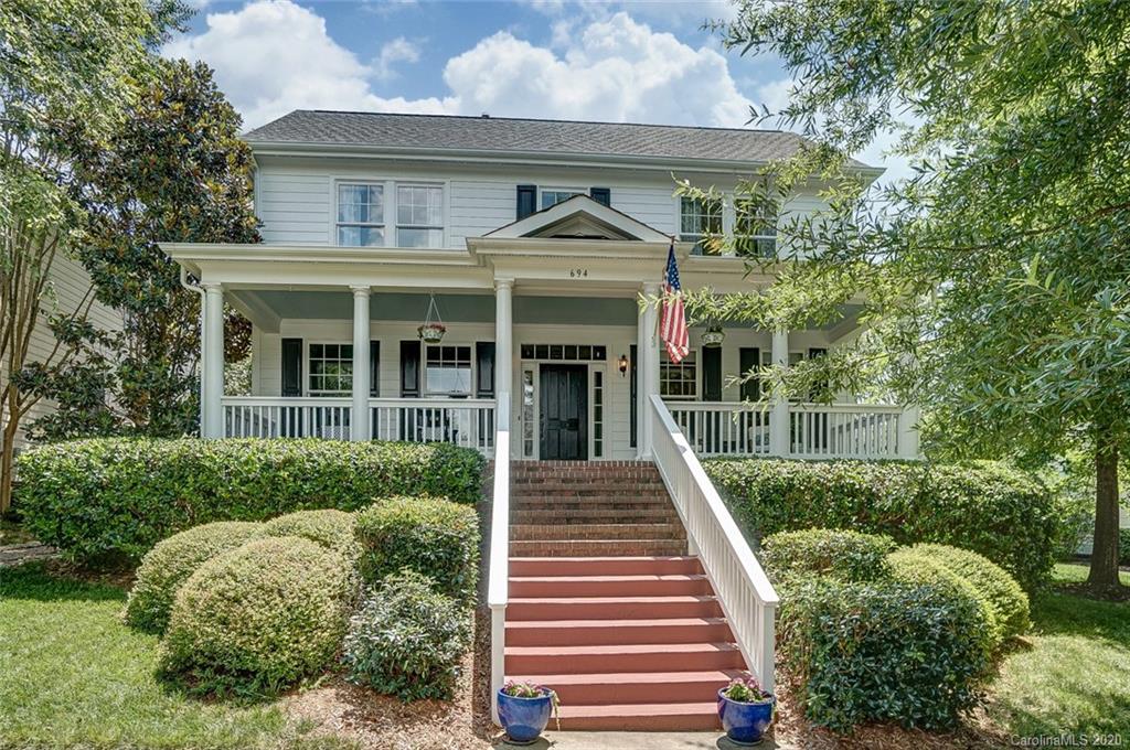 694 Revival Row Fort Mill, SC 29708 - Photo 1 of 46 a front view of a house with a garden