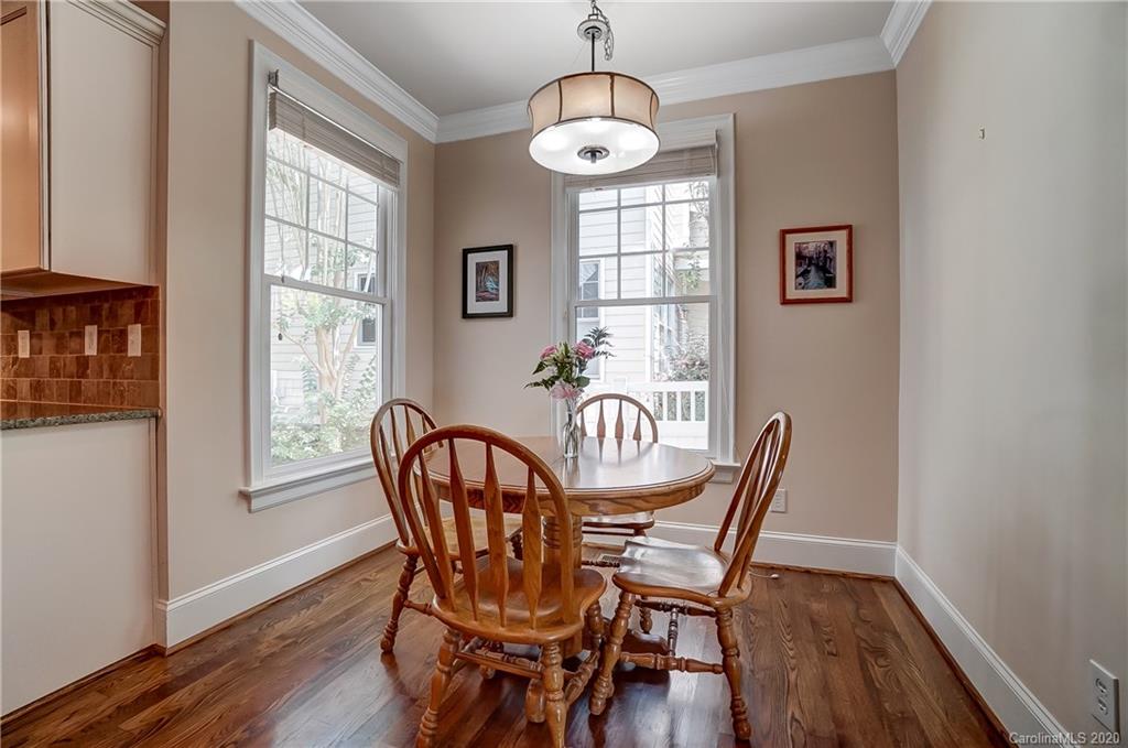 694 Revival Row Fort Mill, SC 29708 - Photo 21 of 46 a view of a dining room with furniture window and wooden floor