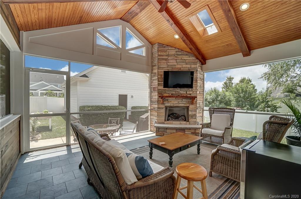 694 Revival Row Fort Mill, SC 29708 - Photo 22 of 46 a outdoor space with patio the couches and a fireplace