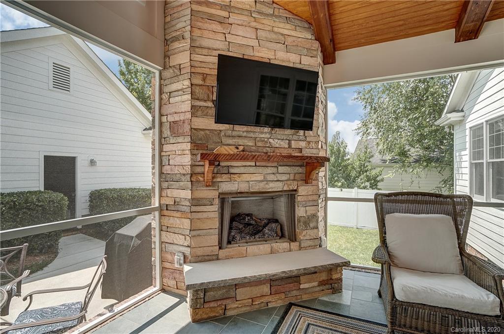 694 Revival Row Fort Mill, SC 29708 - Photo 23 of 46 a living room with furniture a fireplace and a flat screen tv