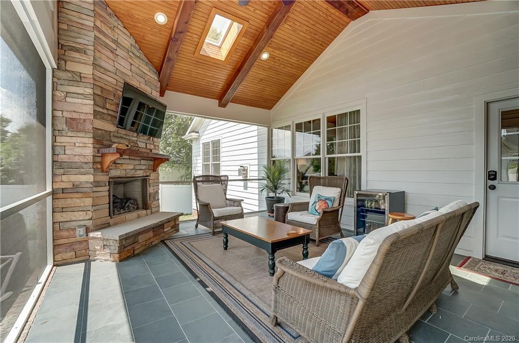694 Revival Row Fort Mill, SC 29708 - Photo 25 of 46 a living room with patio furniture and a fireplace