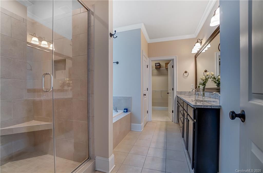 694 Revival Row Fort Mill, SC 29708 - Photo 28 of 46 a bathroom with a sink a toilet and shower