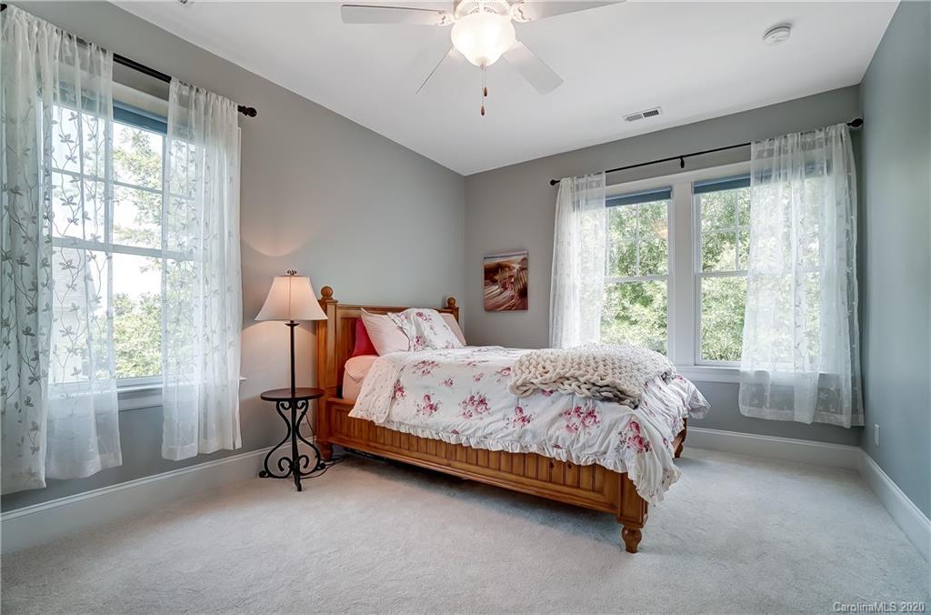 694 Revival Row Fort Mill, SC 29708 - Photo 34 of 46 a bedroom with a bed and a window