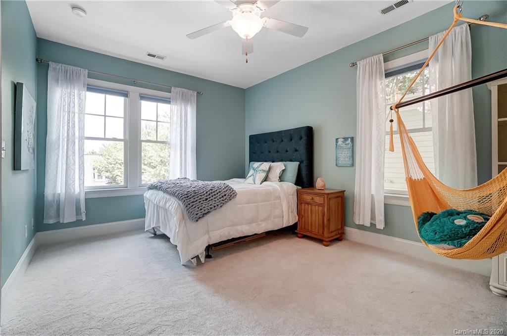 694 Revival Row Fort Mill, SC 29708 - Photo 37 of 46 a bed room with a bed and a chair
