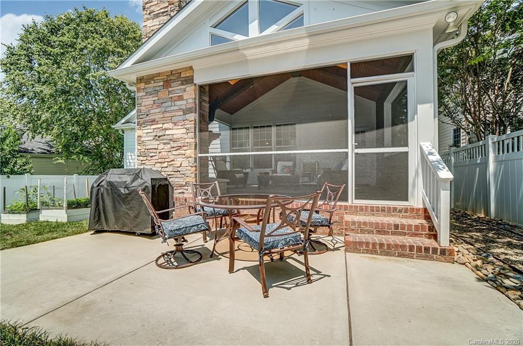 694 Revival Row Fort Mill, SC 29708 - Photo 39 of 46 a view of backyard with barbeque grill and outdoor seating