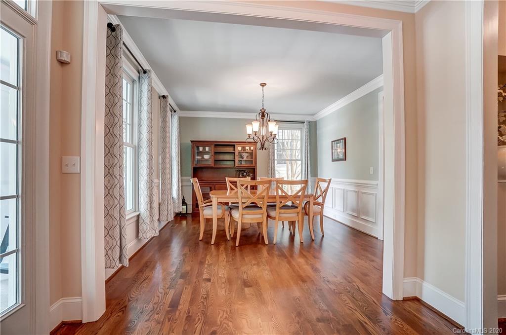 694 Revival Row Fort Mill, SC 29708 - Photo 8 of 46 a view of a dining room with furniture window and wooden floor