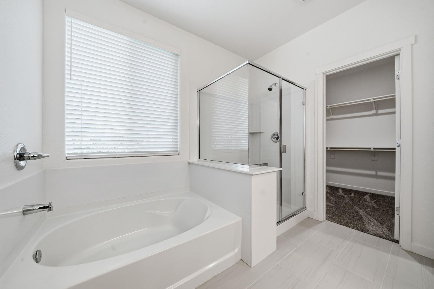 648 Edgewood Loop Angels Camp, CA 95222 - Photo 31 of 58 a spacious bathroom with a bathtub and a shower