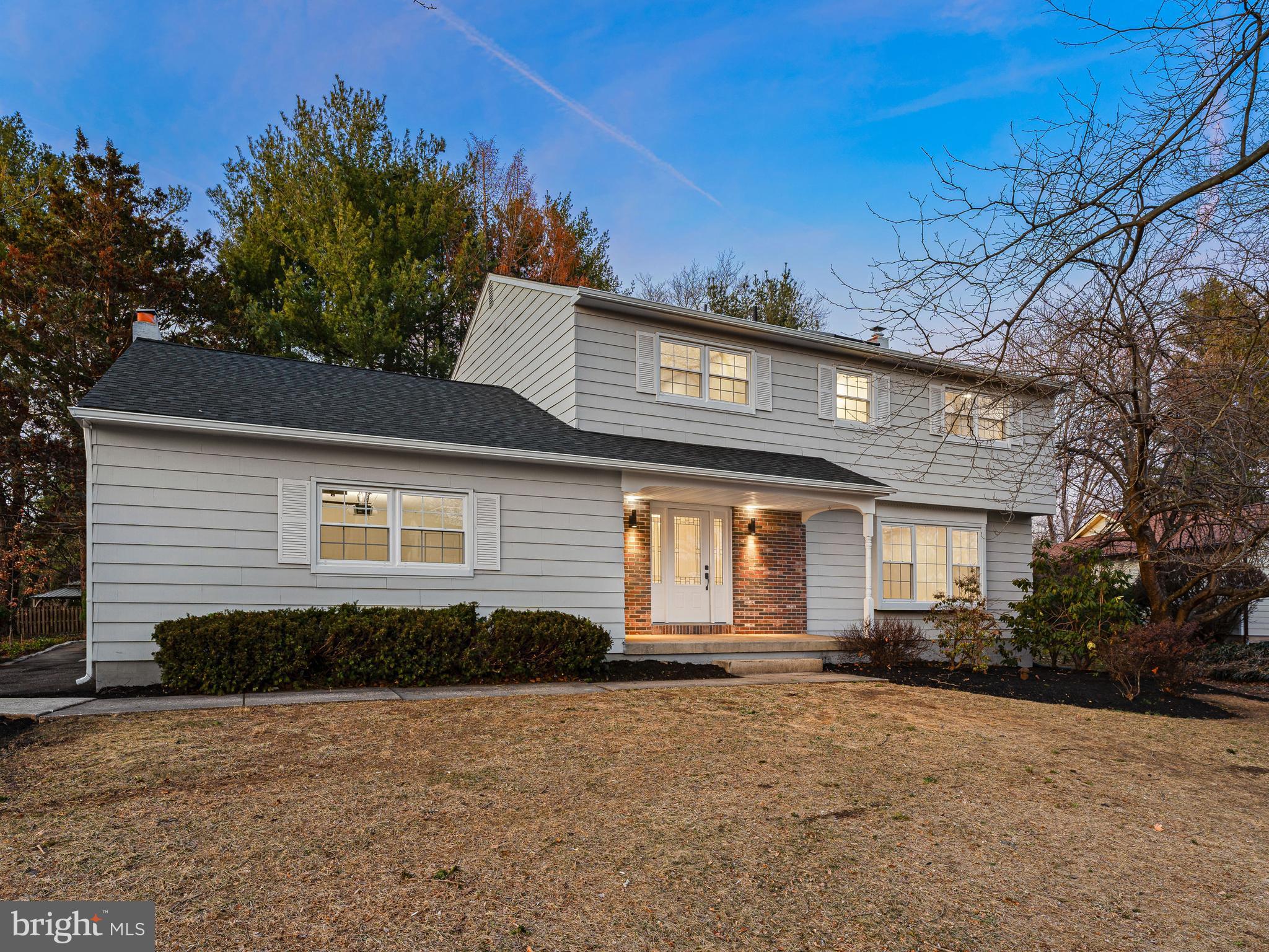 972 Roeloffs Road Yardley, PA 19067 - Photo 1 of 64 a front view of a house with a yard and garage