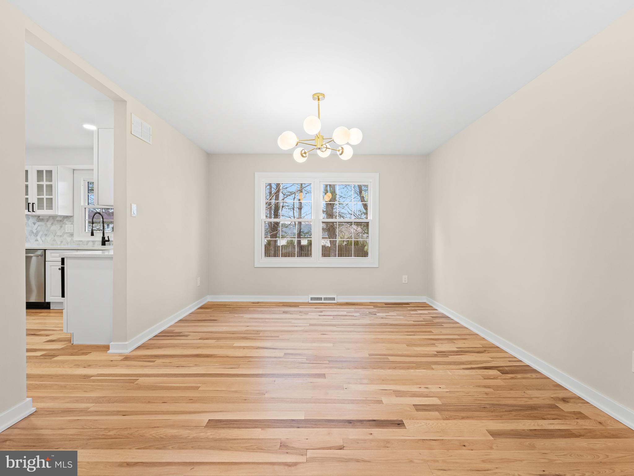 972 Roeloffs Road Yardley, PA 19067 - Photo 12 of 64 a view of an empty room with window and wooden floor