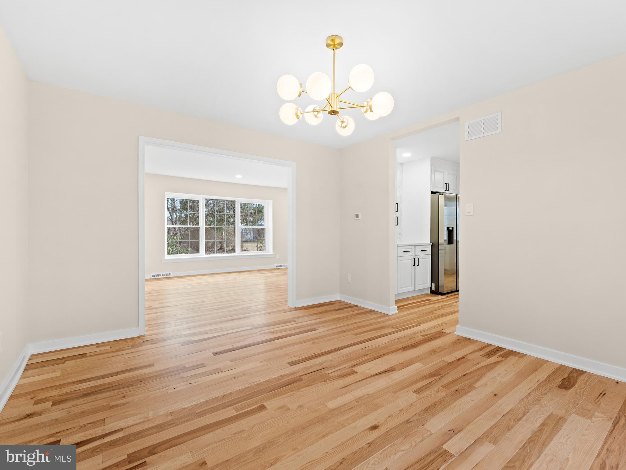 972 Roeloffs Road Yardley, PA 19067 - Photo 13 of 64 a view of an empty room with wooden floor and a window