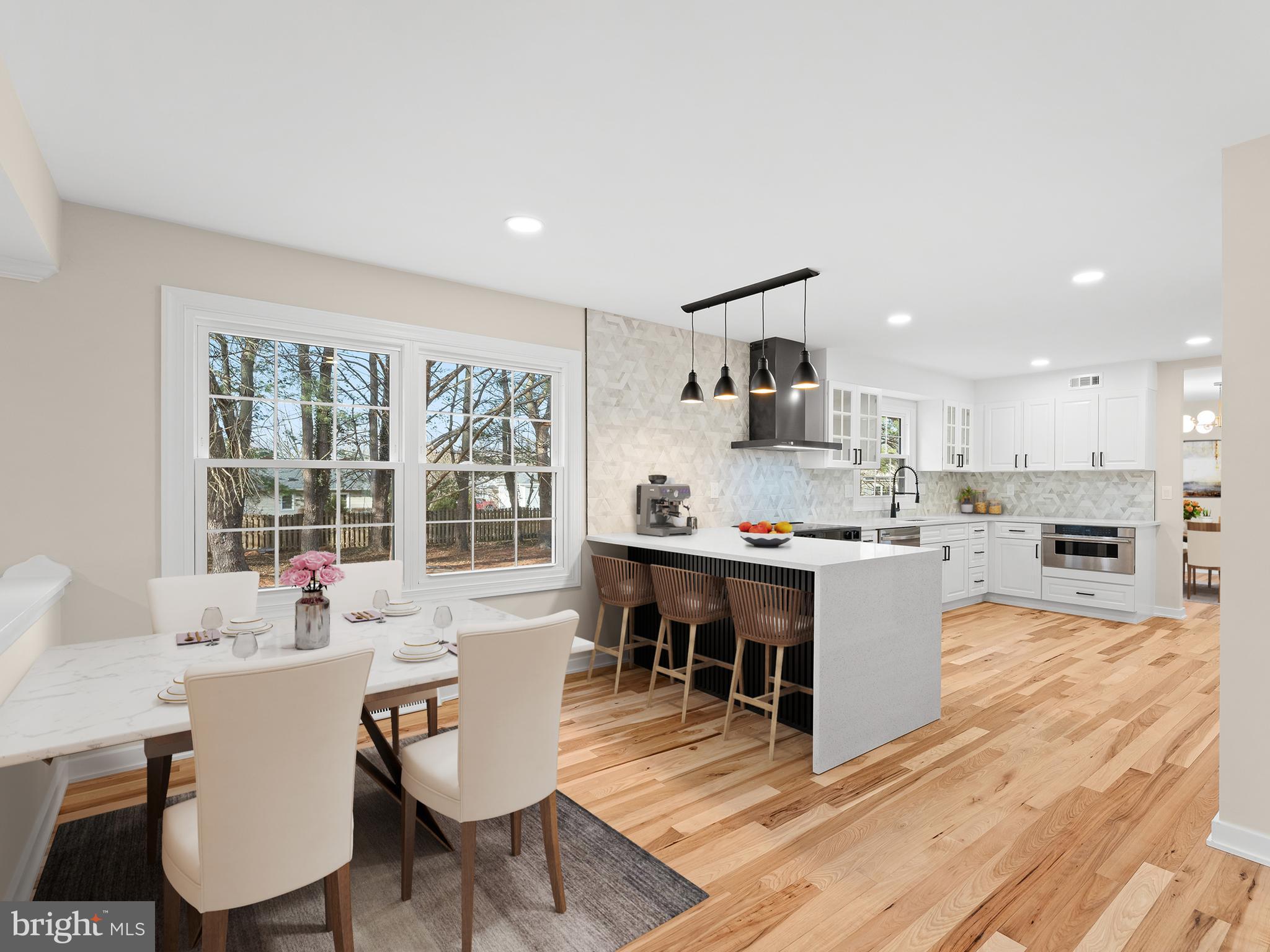 972 Roeloffs Road Yardley, PA 19067 - Photo 14 of 64 a living room with furniture a wooden floor and kitchen view