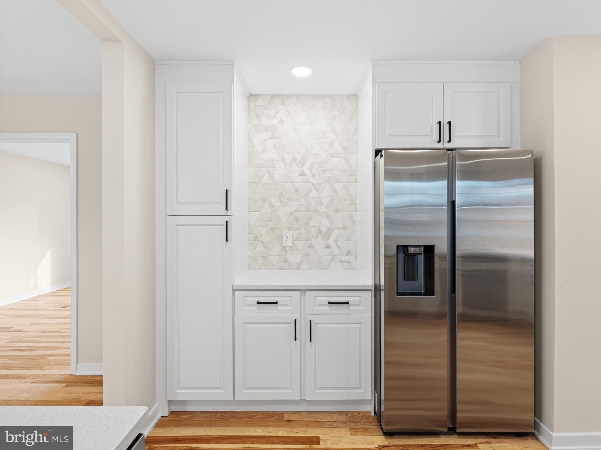 972 Roeloffs Road Yardley, PA 19067 - Photo 23 of 64 a kitchen with stainless steel appliances granite countertop a refrigerator and a sink