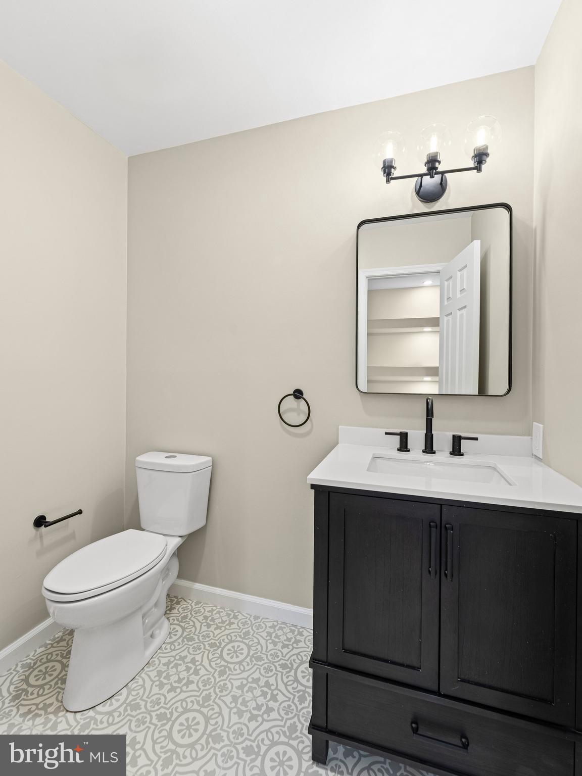 972 Roeloffs Road Yardley, PA 19067 - Photo 26 of 64 a bathroom with a toilet a sink and mirror