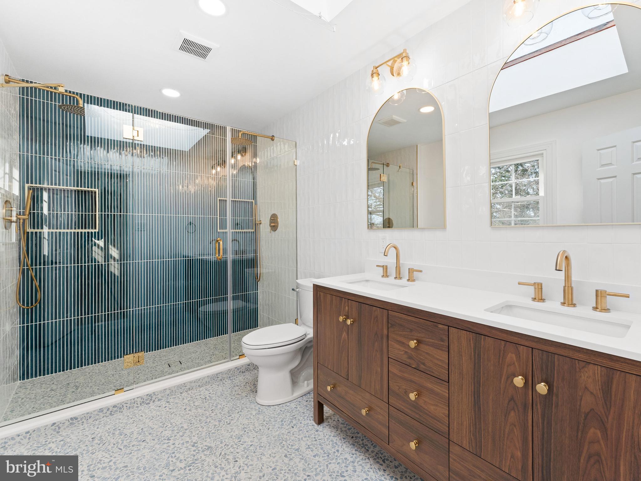 972 Roeloffs Road Yardley, PA 19067 - Photo 30 of 64 a spacious bathroom with a shower sink mirror and toilet