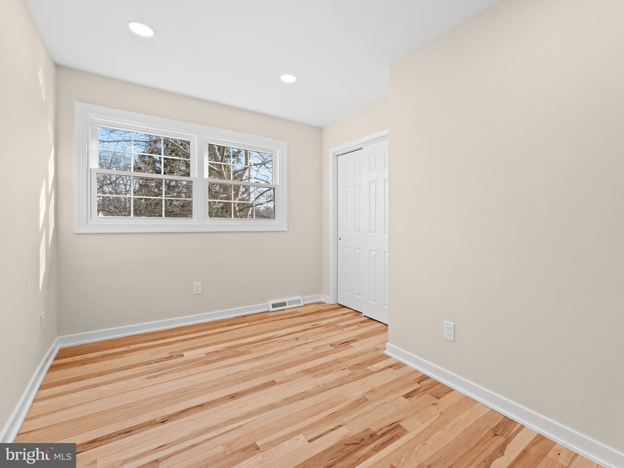 972 Roeloffs Road Yardley, PA 19067 - Photo 42 of 64 a view of an empty room with wooden floor and a window