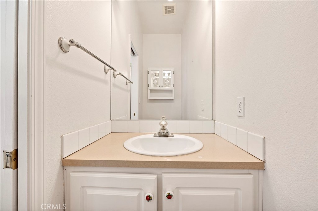 35125 Stirrup Road Temecula, CA 92592 - Photo 17 of 51 a bathroom with a sink and a mirror