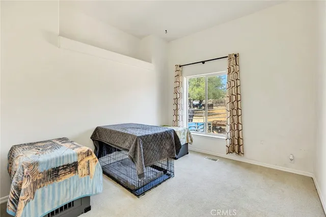 a bedroom with furniture and a window