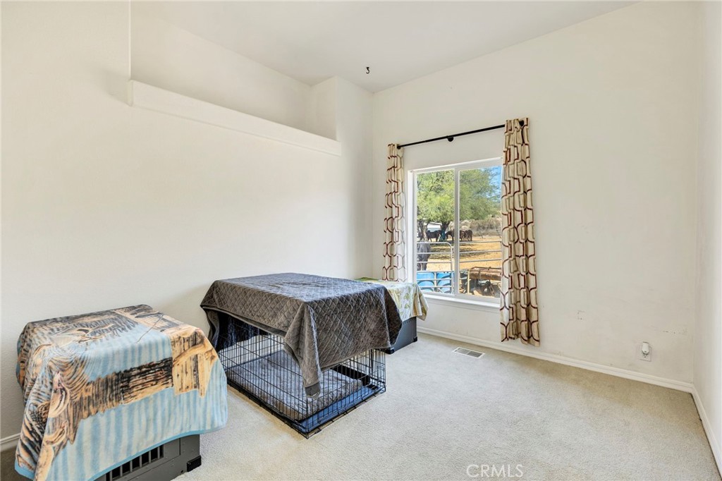 35125 Stirrup Road Temecula, CA 92592 - Photo 19 of 51 a bedroom with furniture and a window