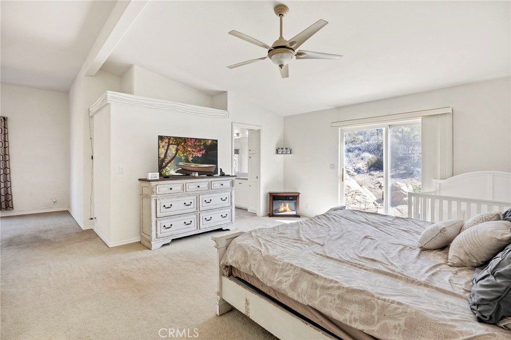 35125 Stirrup Road Temecula, CA 92592 - Photo 21 of 51 a bedroom with a bed and a flat screen tv