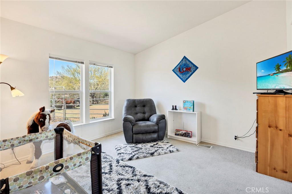 35125 Stirrup Road Temecula, CA 92592 - Photo 26 of 51 a living room with furniture and a window