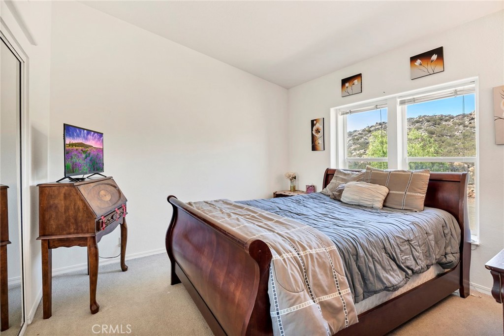 35125 Stirrup Road Temecula, CA 92592 - Photo 27 of 51 a bedroom with a bed and a window