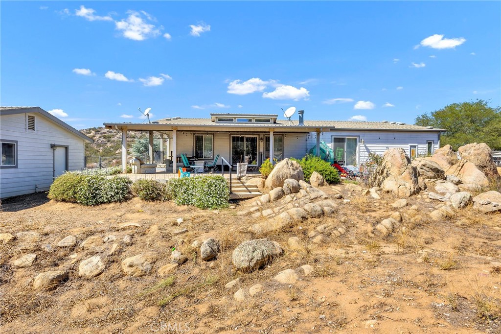 35125 Stirrup Road Temecula, CA 92592 - Photo 31 of 51 a front view of house with yard and trees around