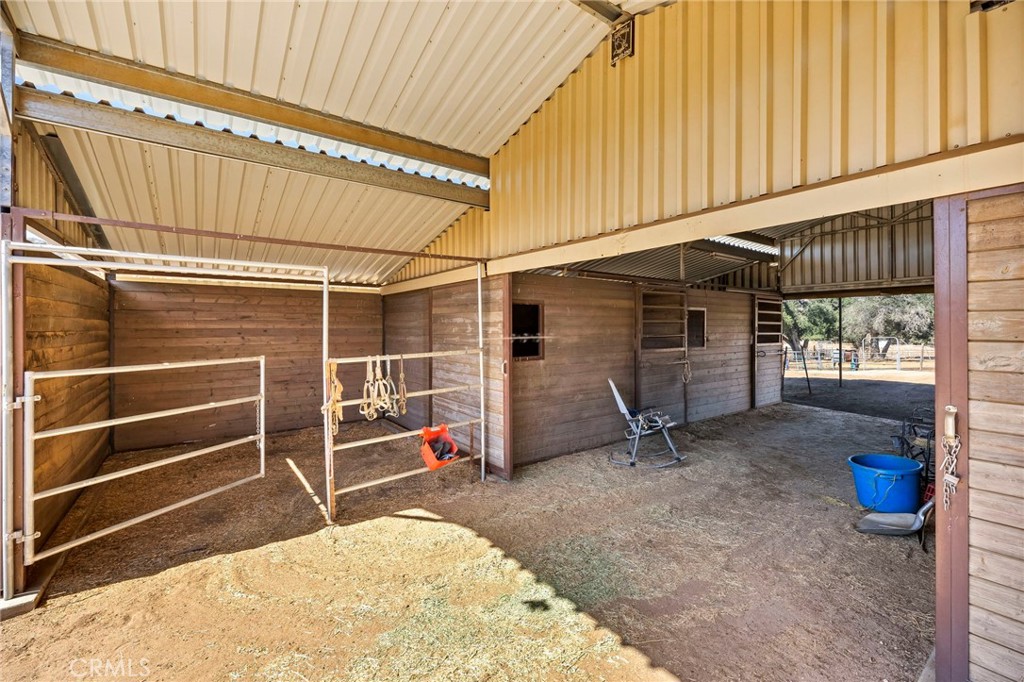 35125 Stirrup Road Temecula, CA 92592 - Photo 34 of 51 a view of an empty room with wooden floor and a window