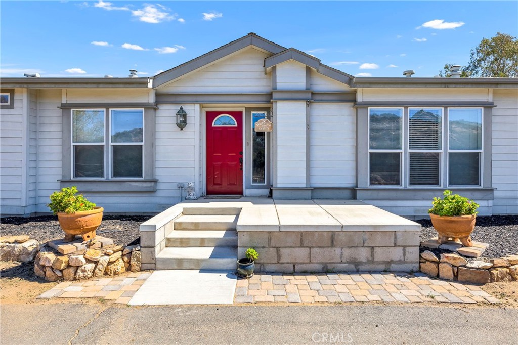 35125 Stirrup Road Temecula, CA 92592 - Photo 4 of 51 a front view of house with outdoor seating