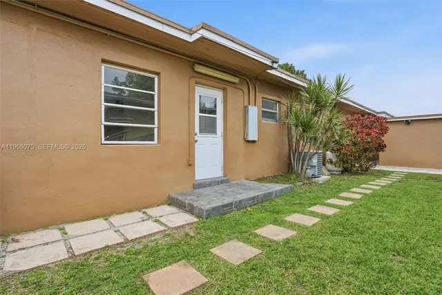 a backyard of a house with seating space