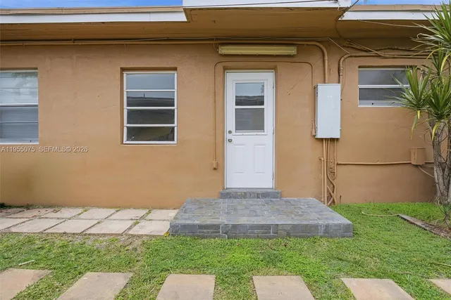a view of a hallway with washer and dryer