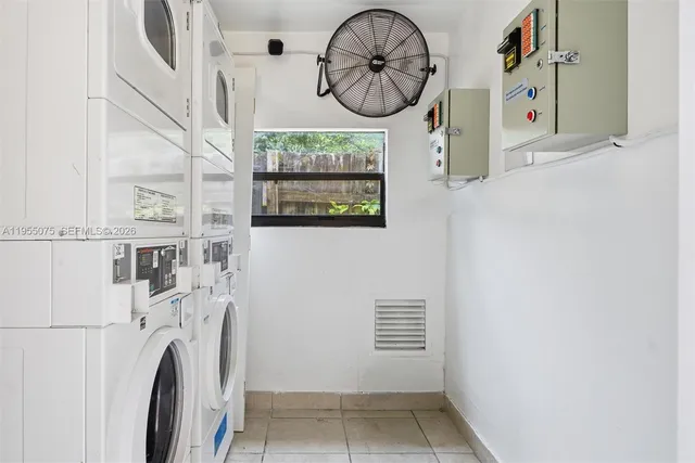 a view of a hallway with washer and dryer