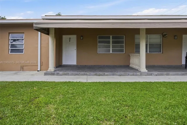 a view of front door and yard