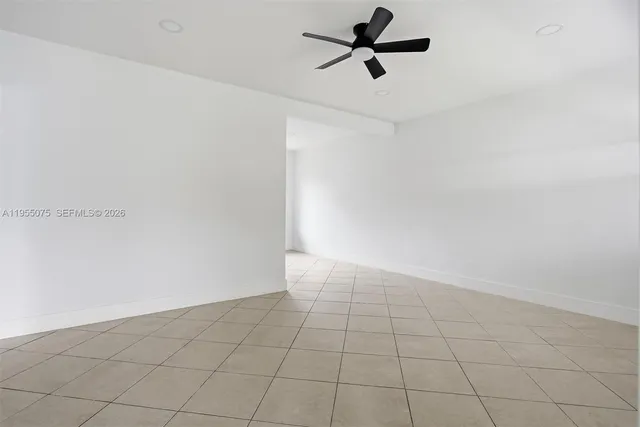 a kitchen with granite countertop a stove top oven and cabinets