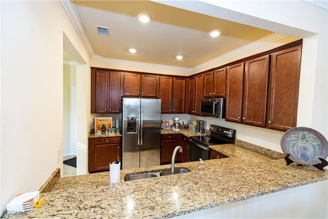 a view of a living room and kitchen