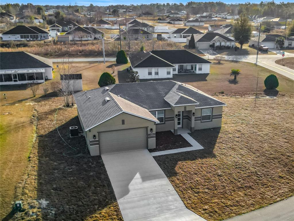an aerial view of a house with a ocean view