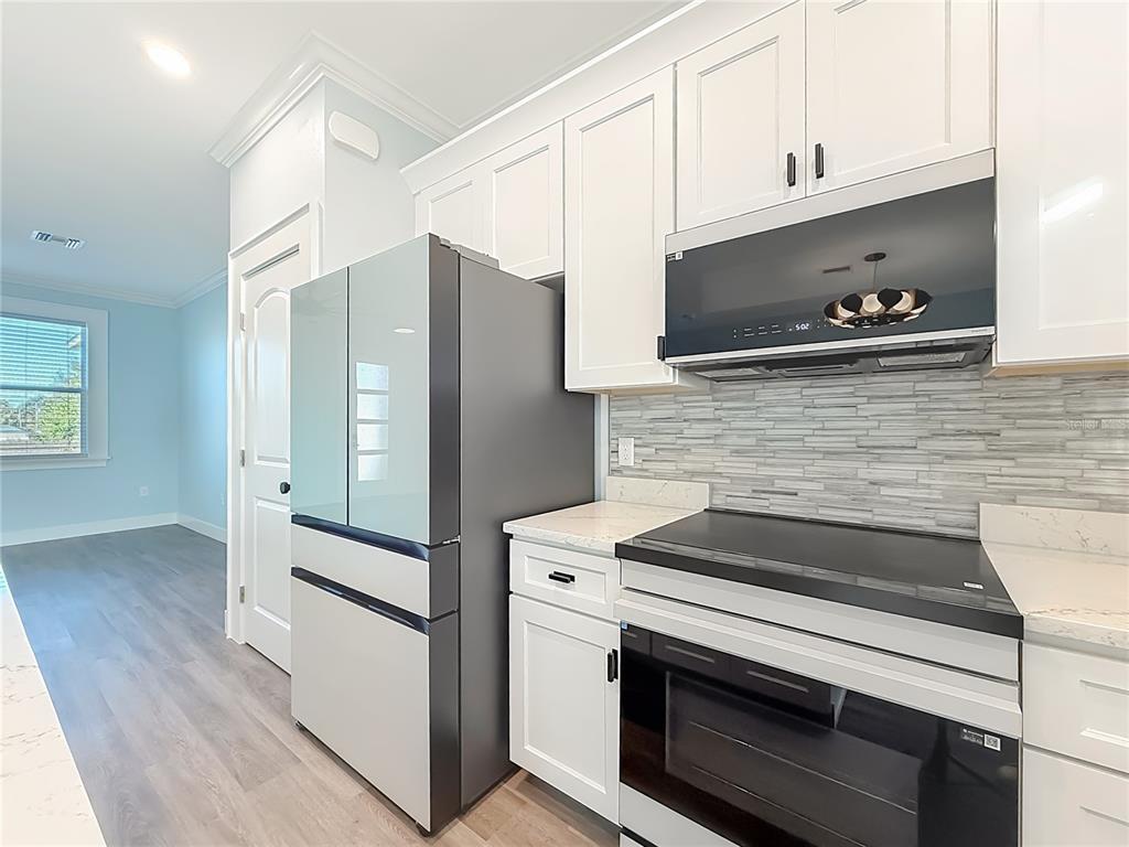 12847 Southwest 73rd Street Ocala, FL 34473 - Photo 12 of 28 a kitchen with appliances and cabinets