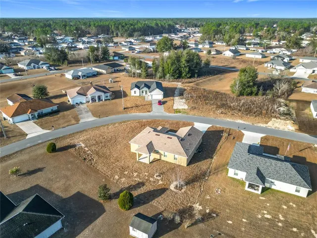an aerial view of a houses with outdoor space